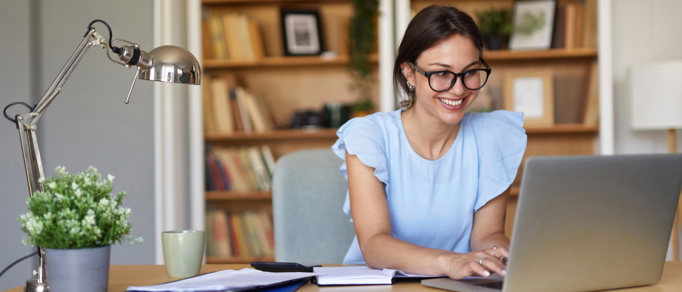 smiling woman working on the computer