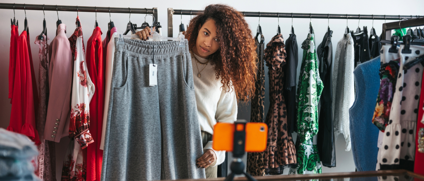 woman do a live stream selling her clothes on a resale app